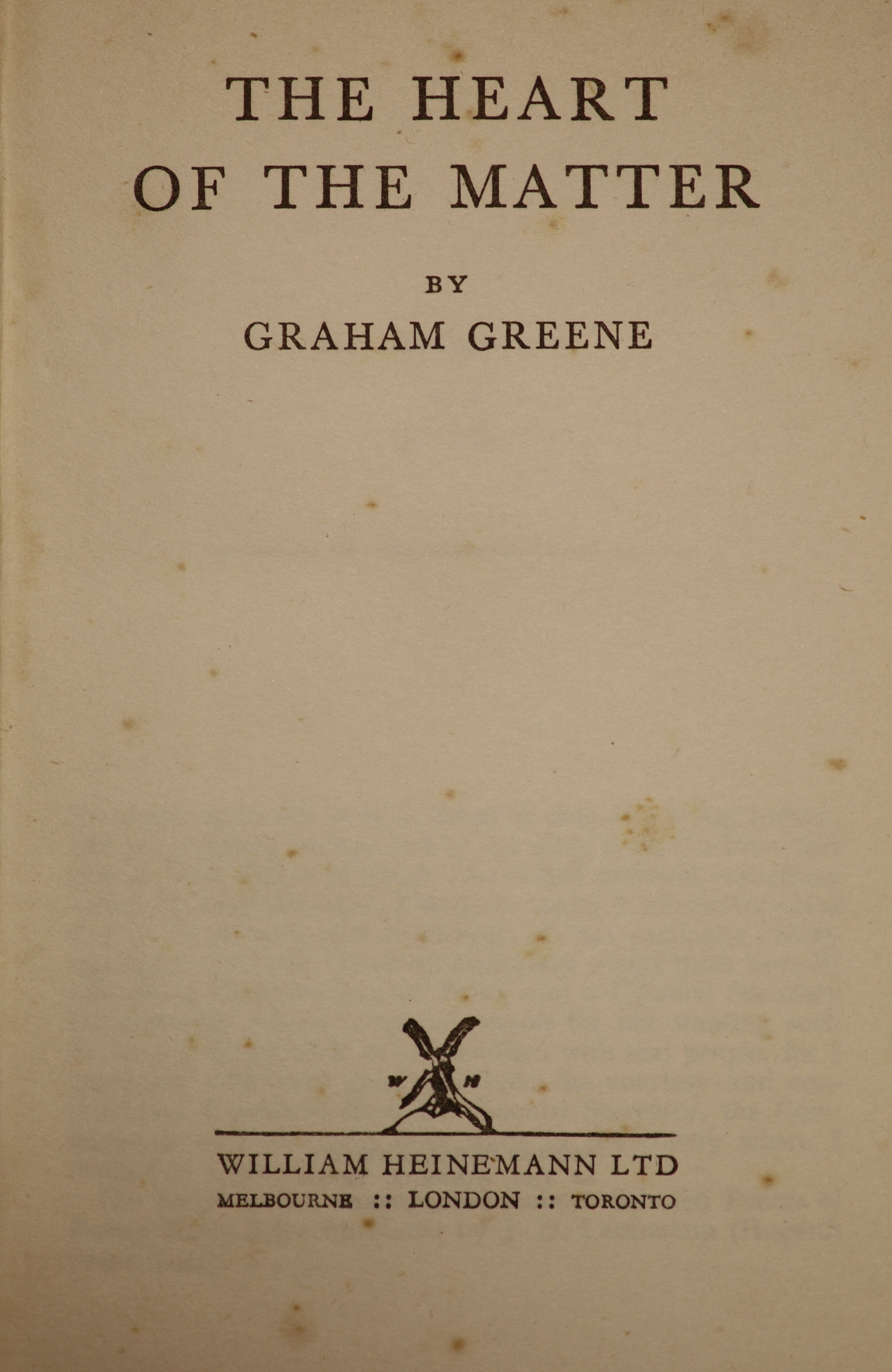 Greene, Graham - The Heart of the Matter, 1st edition, original blue cloth, in unclipped d/j with tears and loss, ink inscription to front fly leaf, text with occasional spotting,William Heinemann, London, 1948